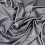 Grey Faux Acetate Satin — mid-weight double-faced polyester satin with a delustered finish, fluid drape and slight stretch