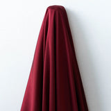 Rust Faux Acetate Satin — mid-weight double-faced polyester satin with a delustered finish, fluid drape and slight stretch