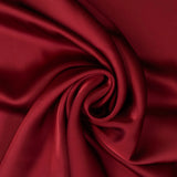Rust Faux Acetate Satin — mid-weight double-faced polyester satin with a delustered finish, fluid drape and slight stretch