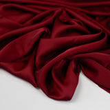 Rust Faux Acetate Satin — mid-weight double-faced polyester satin with a delustered finish, fluid drape and slight stretch