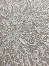 Ivory Embroidered Floral Tulle — featuring floral motifs and hand-beading, 50% nylon 50% rayon, 130cm wide