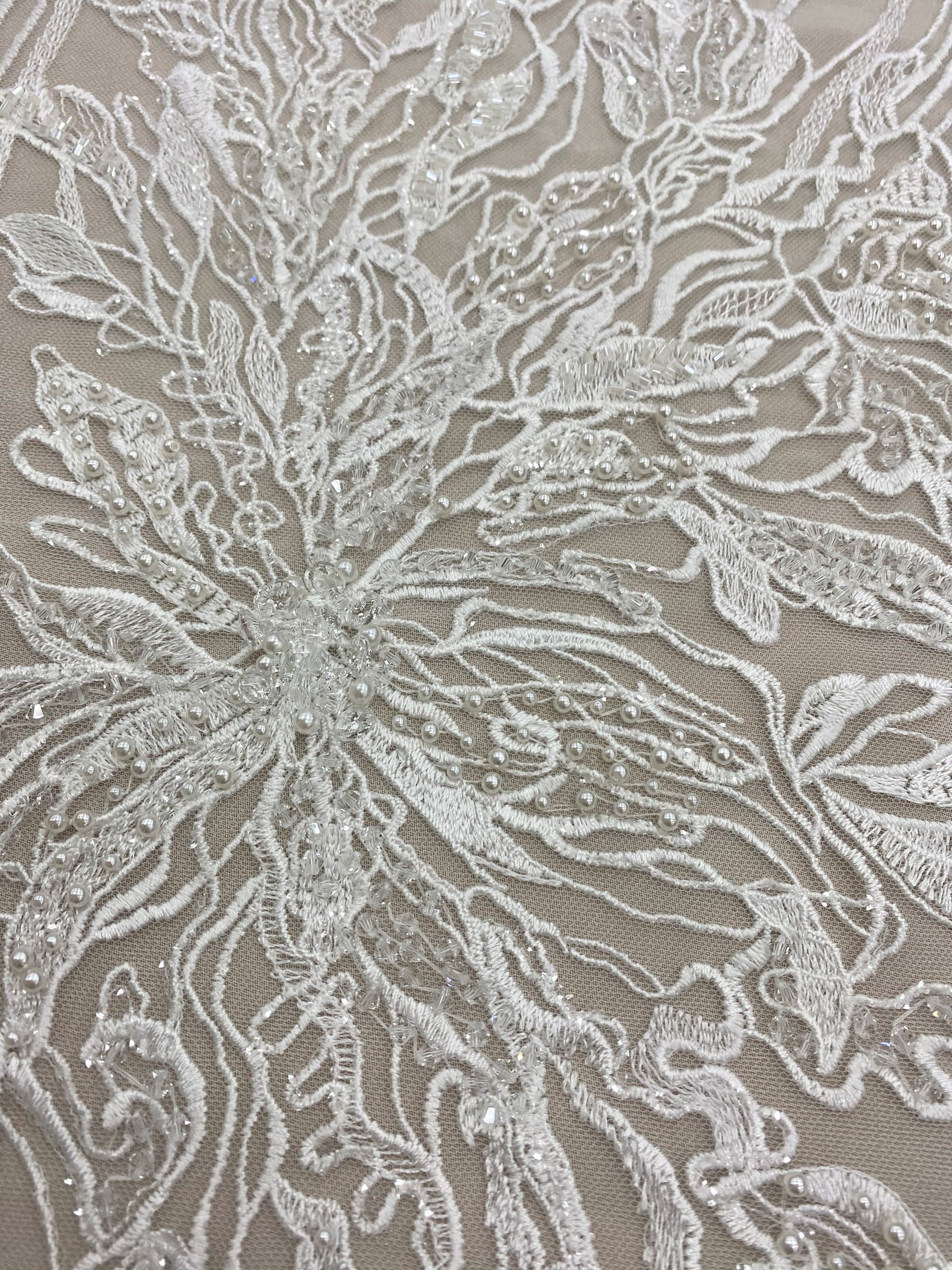 Ivory Embroidered Floral Tulle — featuring floral motifs and hand-beading, 50% nylon 50% rayon, 130cm wide