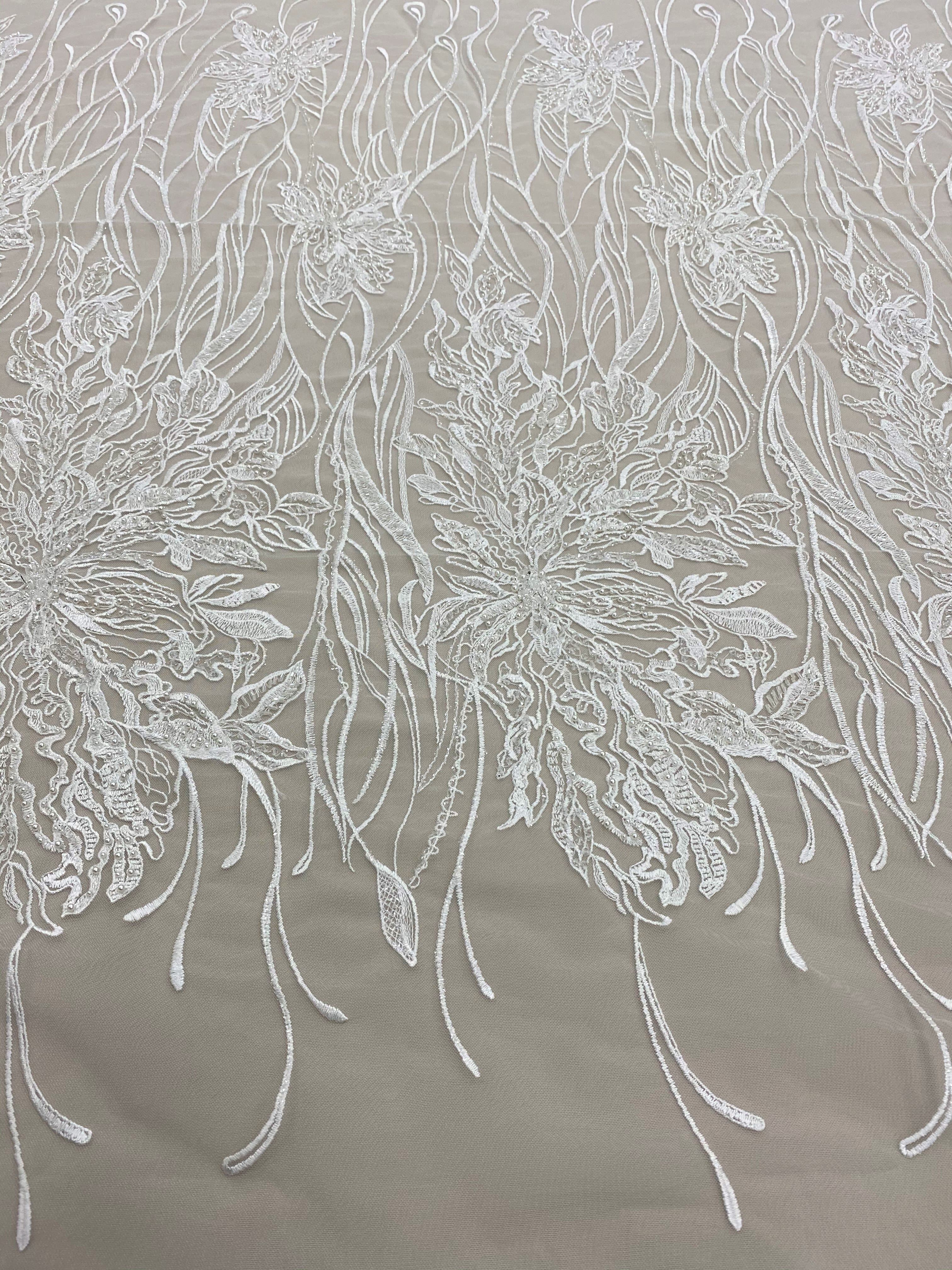 Ivory Embroidered Floral Tulle — featuring floral motifs and hand-beading, 50% nylon 50% rayon, 130cm wide
