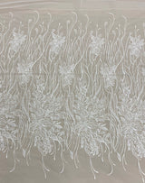 Ivory Embroidered Floral Tulle — featuring floral motifs and hand-beading, 50% nylon 50% rayon, 130cm wide
