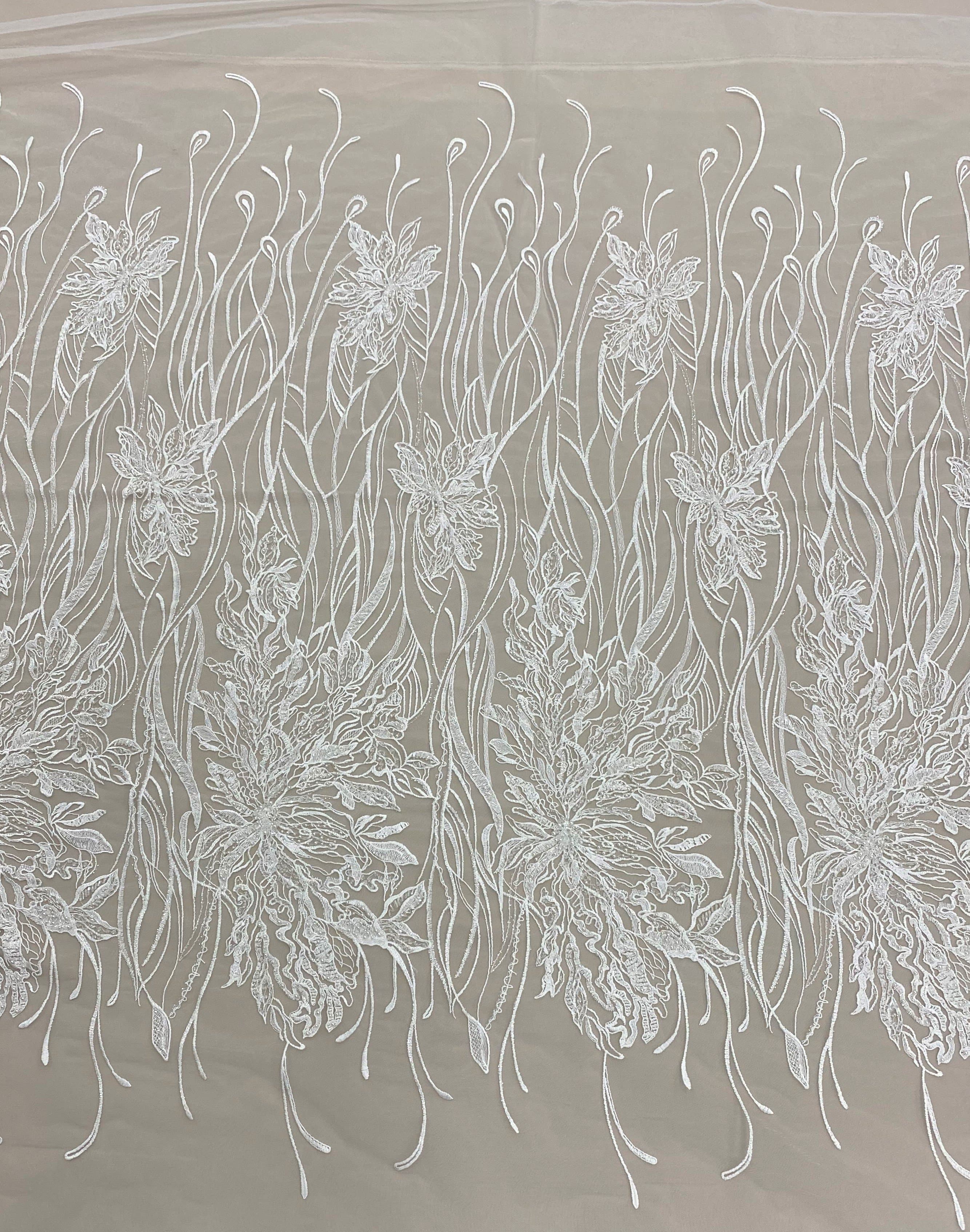 Ivory Embroidered Floral Tulle — featuring floral motifs and hand-beading, 50% nylon 50% rayon, 130cm wide