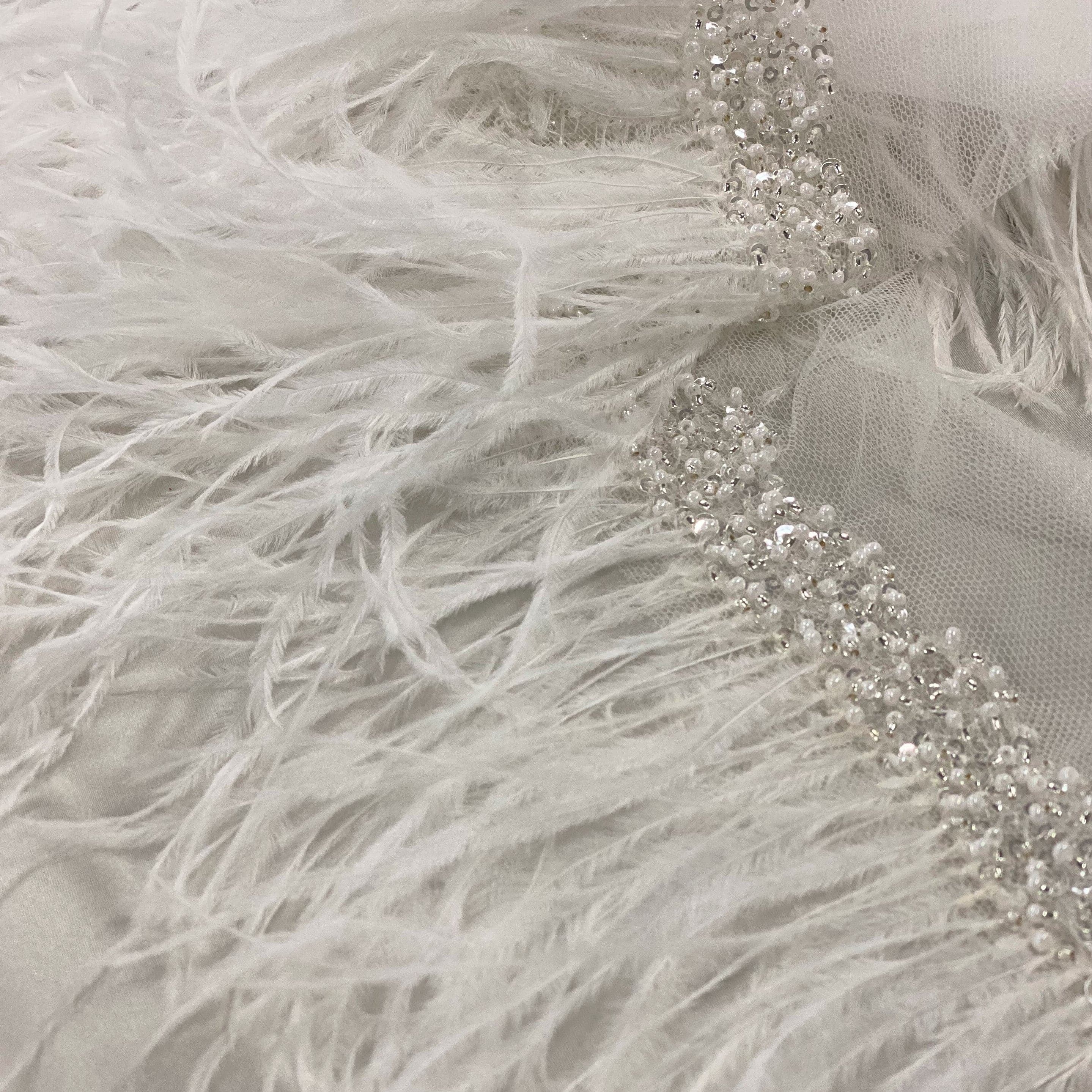 Ostrich feather trim — featuring a soft feather edge with delicate beading, mounted on tulle