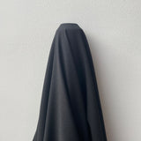Black Wool Crepe — a medium-weight wool-blend crepe suiting with a soft handle, 137cm wide