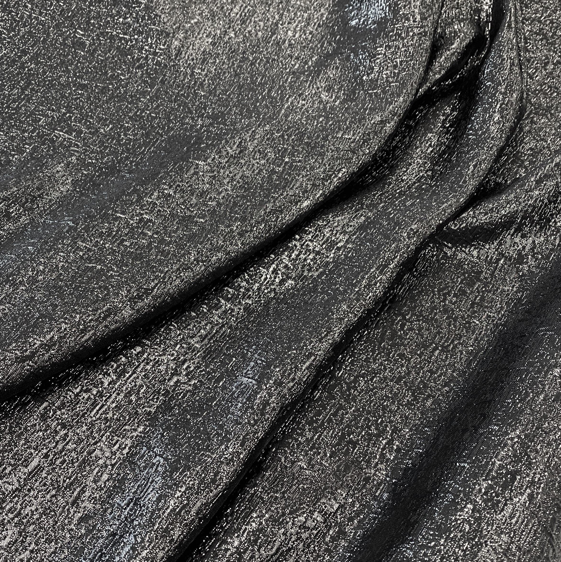 Black Metallic Jacquard — featuring a woven metallic jacquard design with a soft feel and stiff drape, 140cm wide