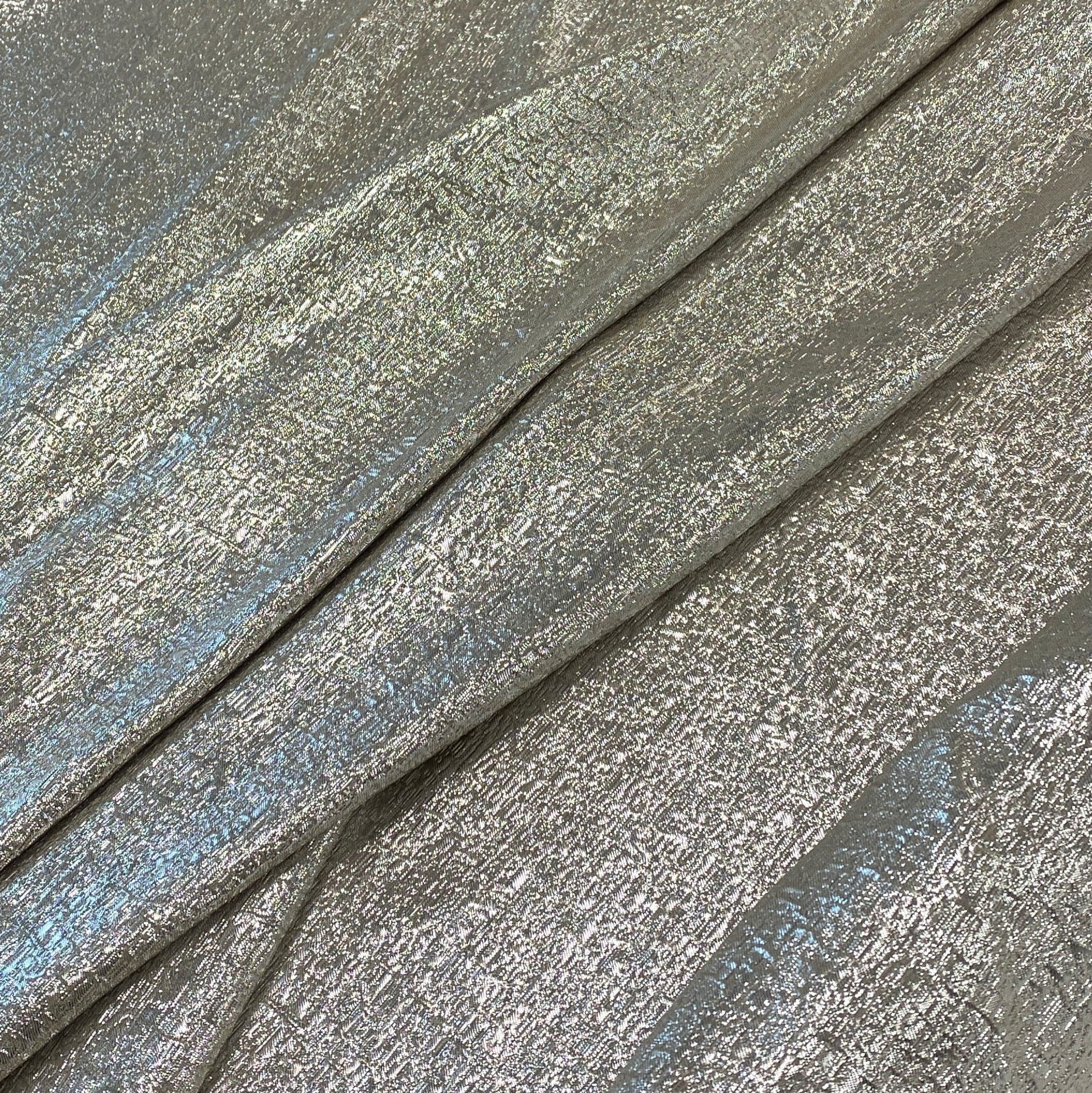 White Gold Metallic Jacquard — featuring a woven metallic jacquard design with a soft feel and stiff drape, 140cm wide
