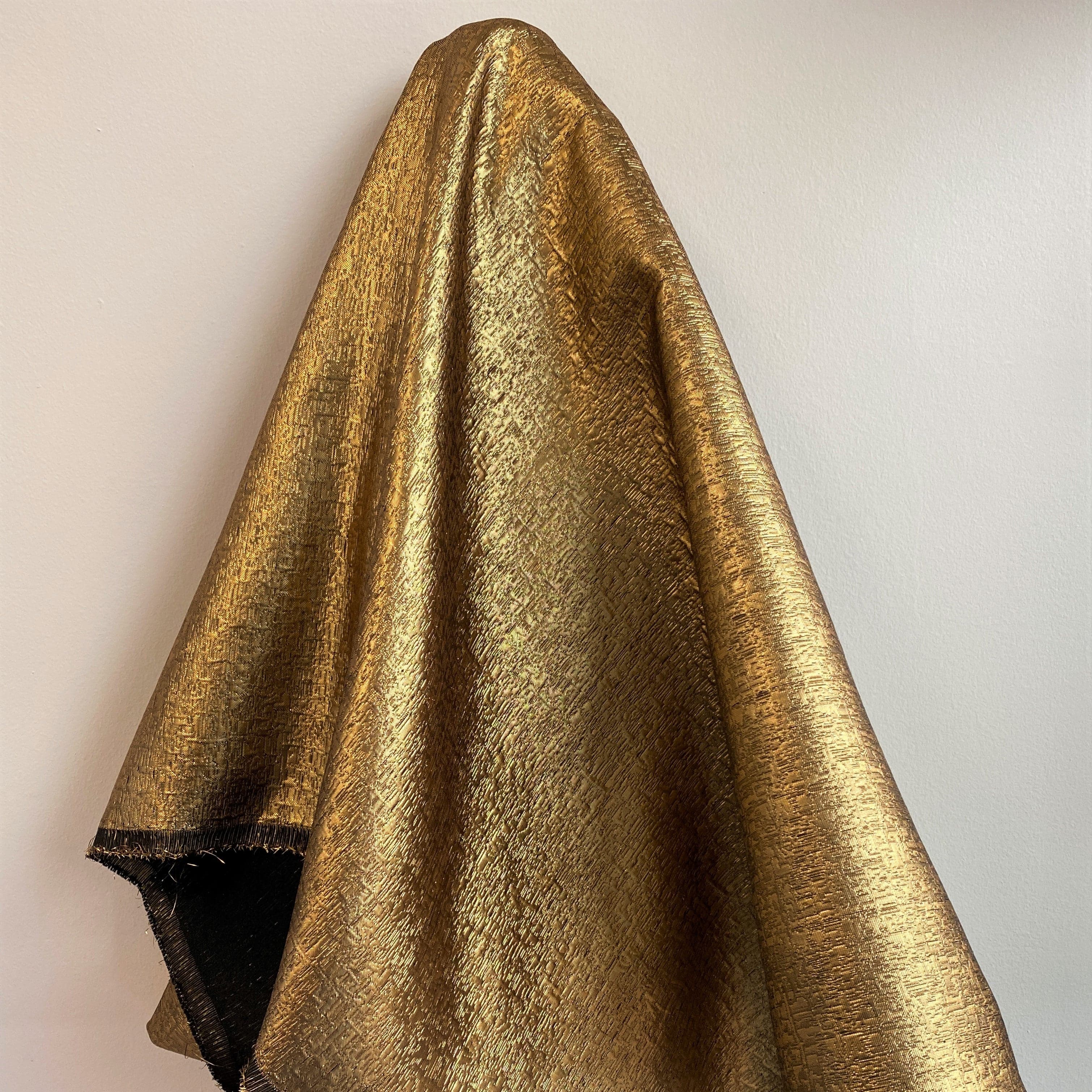 Ochre Metallic Jacquard — featuring a woven metallic jacquard design with a soft feel and stiff drape, 140cm wide