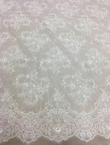 Ivory Delicate Floral Lace — featuring scalloped edges and floral motifs, in nylon, 140cm wide