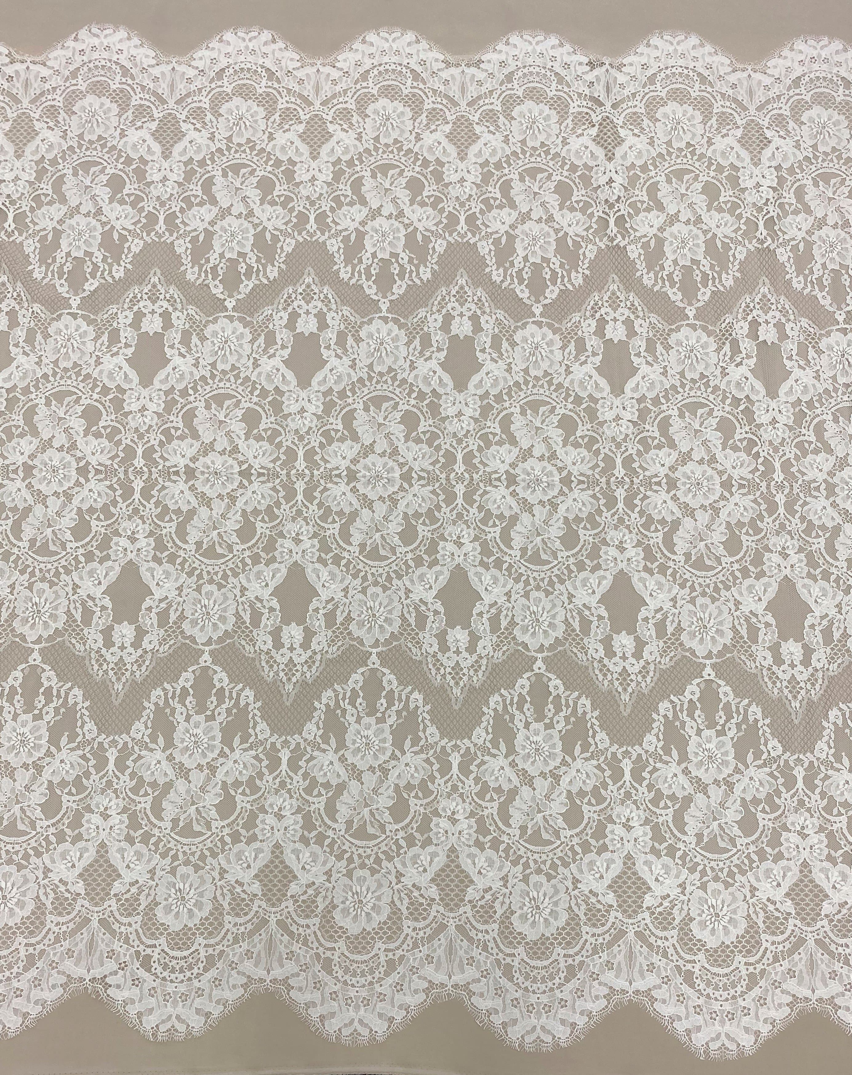 Ivory Fine Floral Lace — featuring scalloped edges and floral motifs, in cotton and nylon, 140cm wide