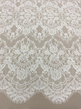 Ivory Fine Floral Lace — featuring scalloped edges and floral motifs, in cotton and nylon, 140cm wide