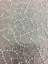 Ivory Abstract Fine Lace — featuring scalloped edges and an abstract web-like design, in nylon, 95cm wide