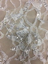 Ivory Beaded Floral Lace — featuring scalloped edges, floral motifs and hand-beading, 130cm wide