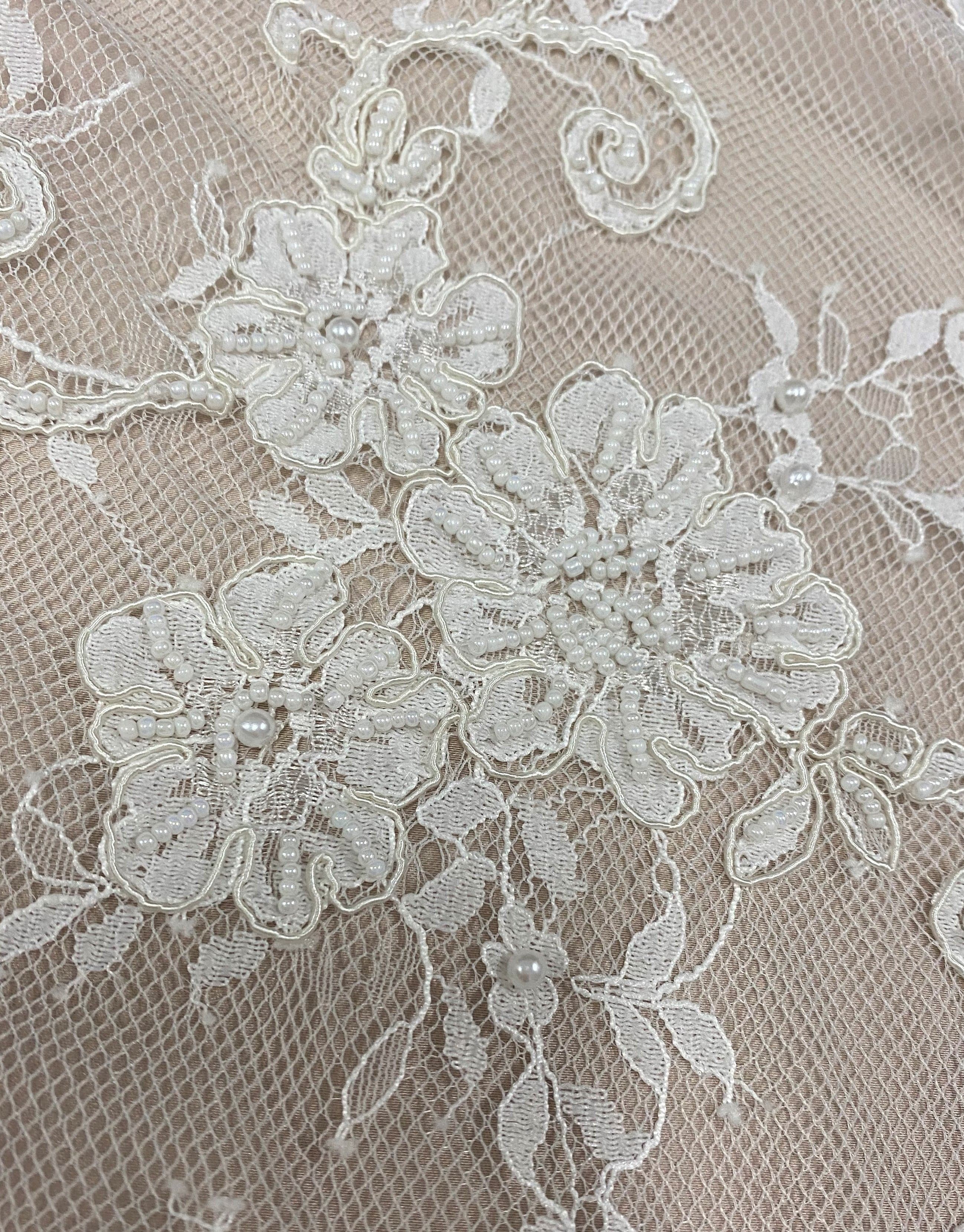 Ivory Corded Beaded Floral Lace — featuring scalloped edges, eyelash detail and a corded texture, in nylon, 140cm wide