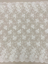 Ivory Corded Floral Lace — featuring scalloped edges, eyelash detail and floral motifs, 140cm wide