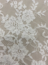 Ivory Corded Floral Lace — featuring scalloped edges, eyelash detail and floral motifs, 140cm wide