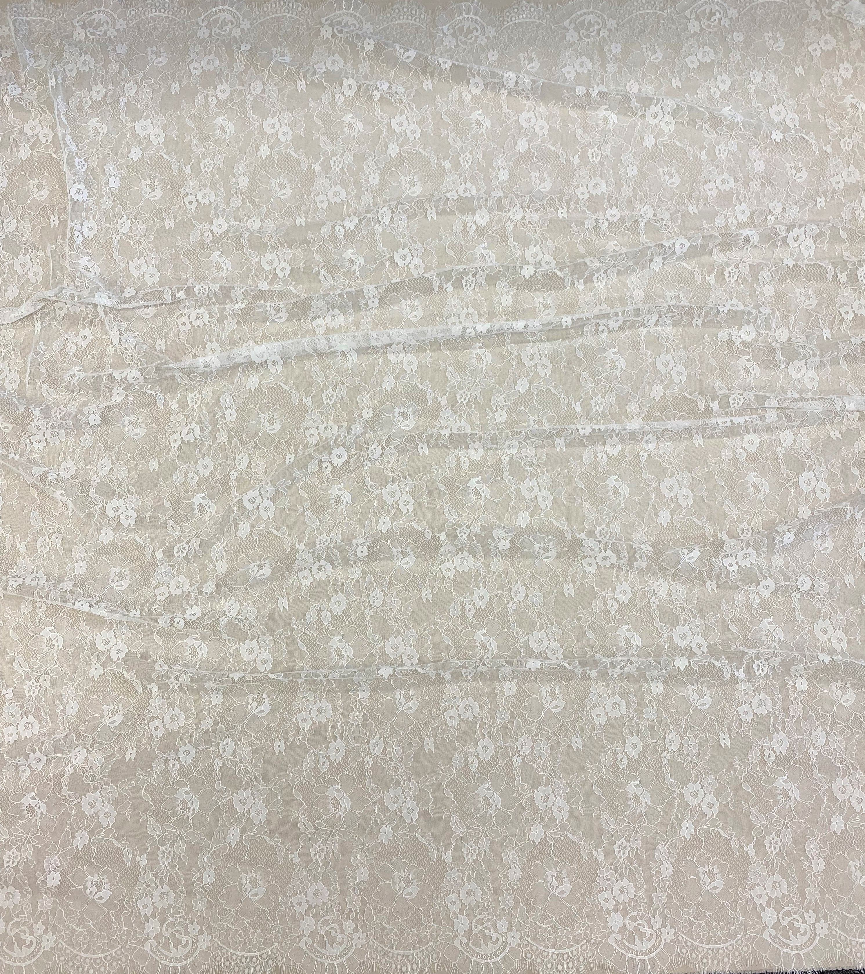 Ivory Fine Lace — featuring scalloped edges and floral motifs, in viscose and nylon, 140cm wide
