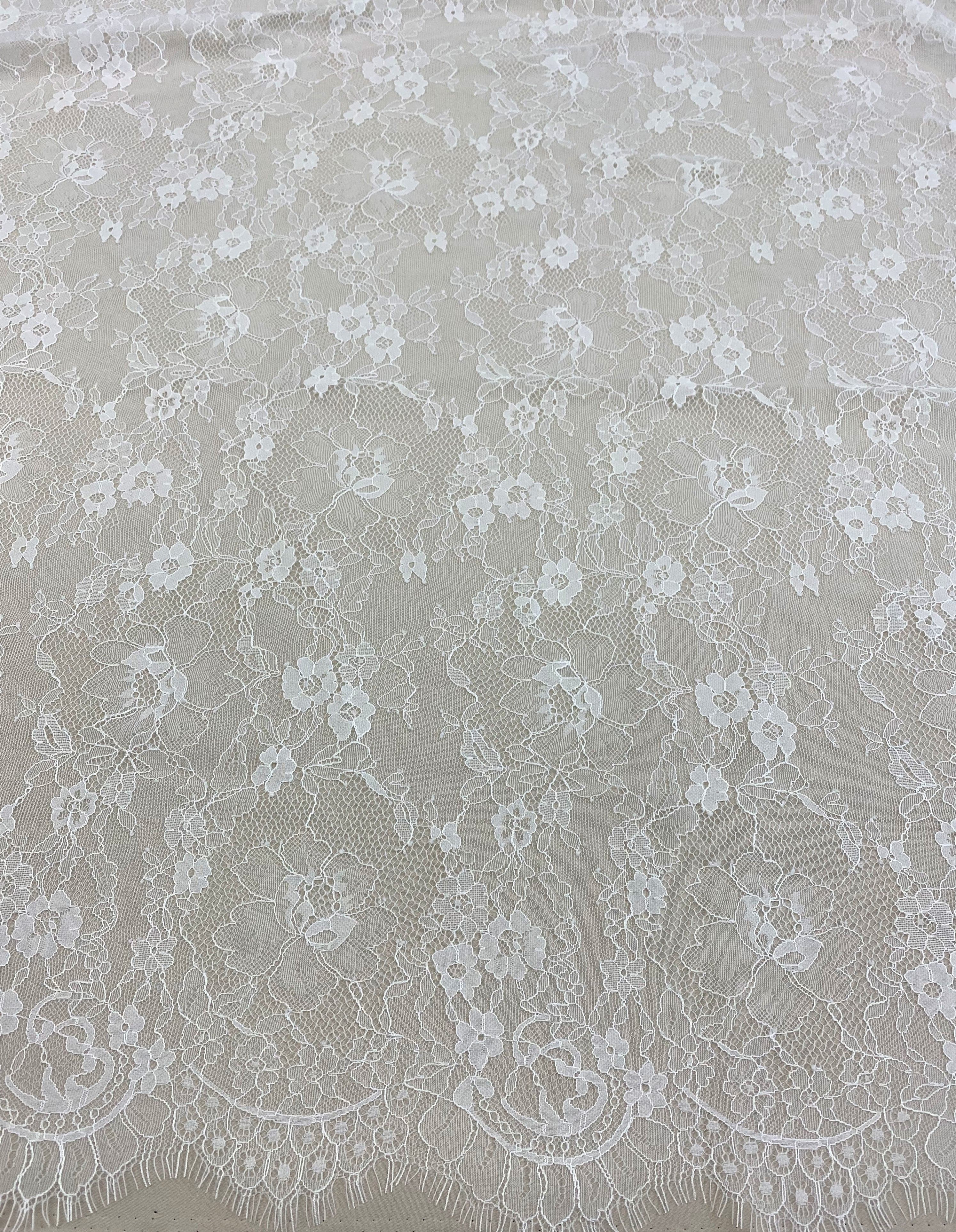 Ivory Fine Lace — featuring scalloped edges and floral motifs, in viscose and nylon, 140cm wide