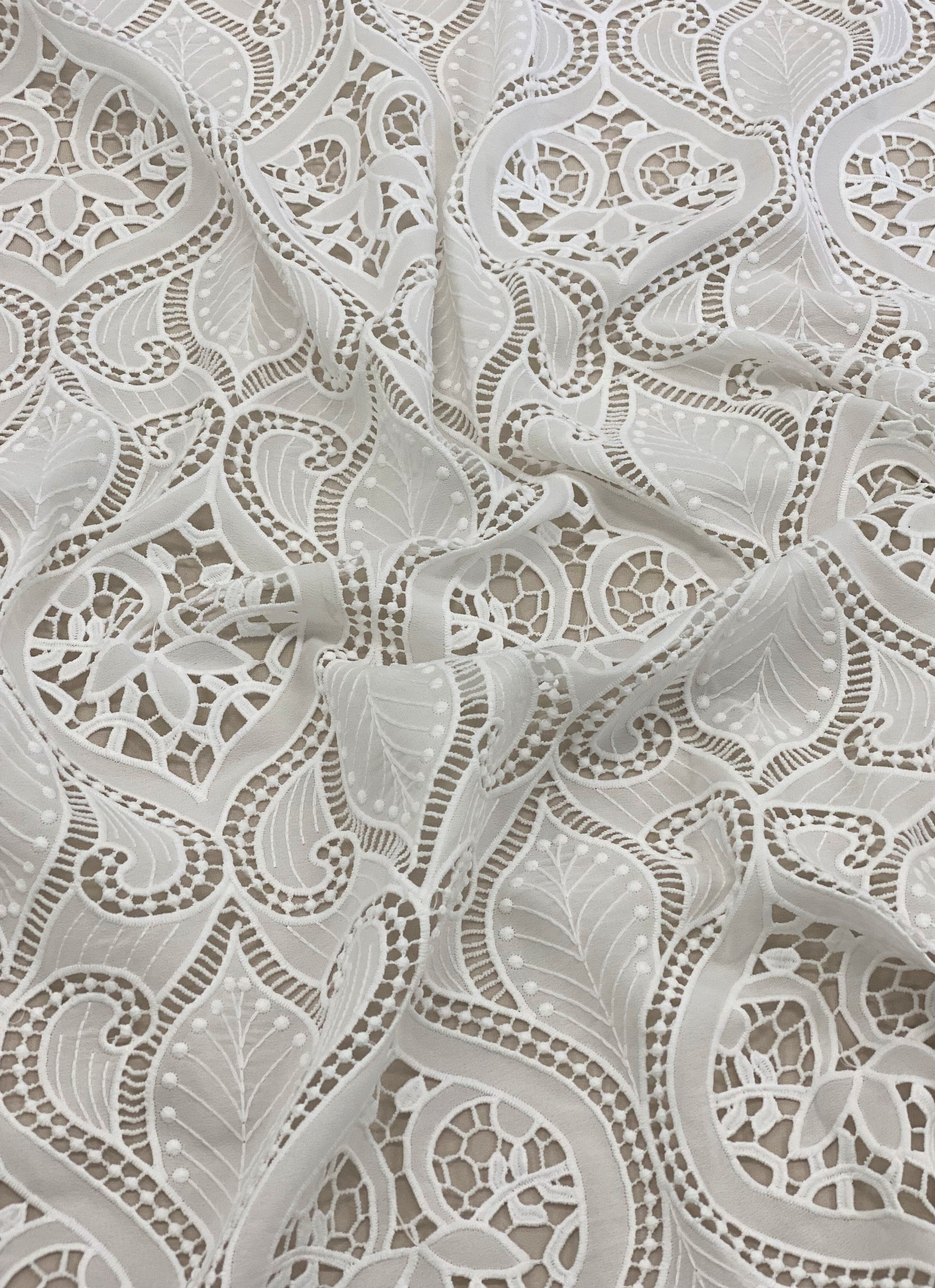 Ivory Embroidered Cutwork — featuring scalloped edges, eyelash detail and Guipure motifs, 100% polyester, 120cm wide