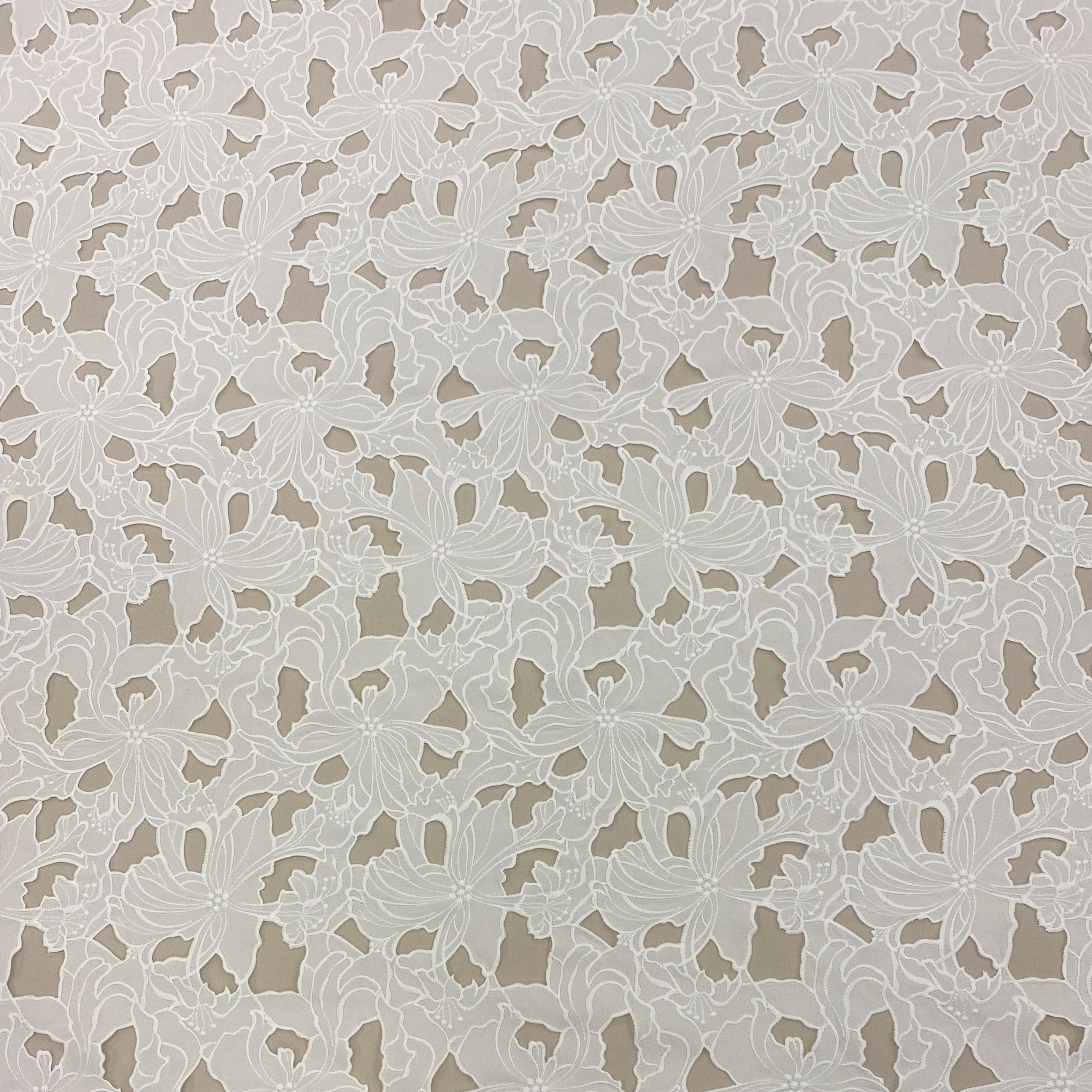 Ivory Embroidered Cutwork — featuring a floral cutwork design, 100% polyester, 130cm wide