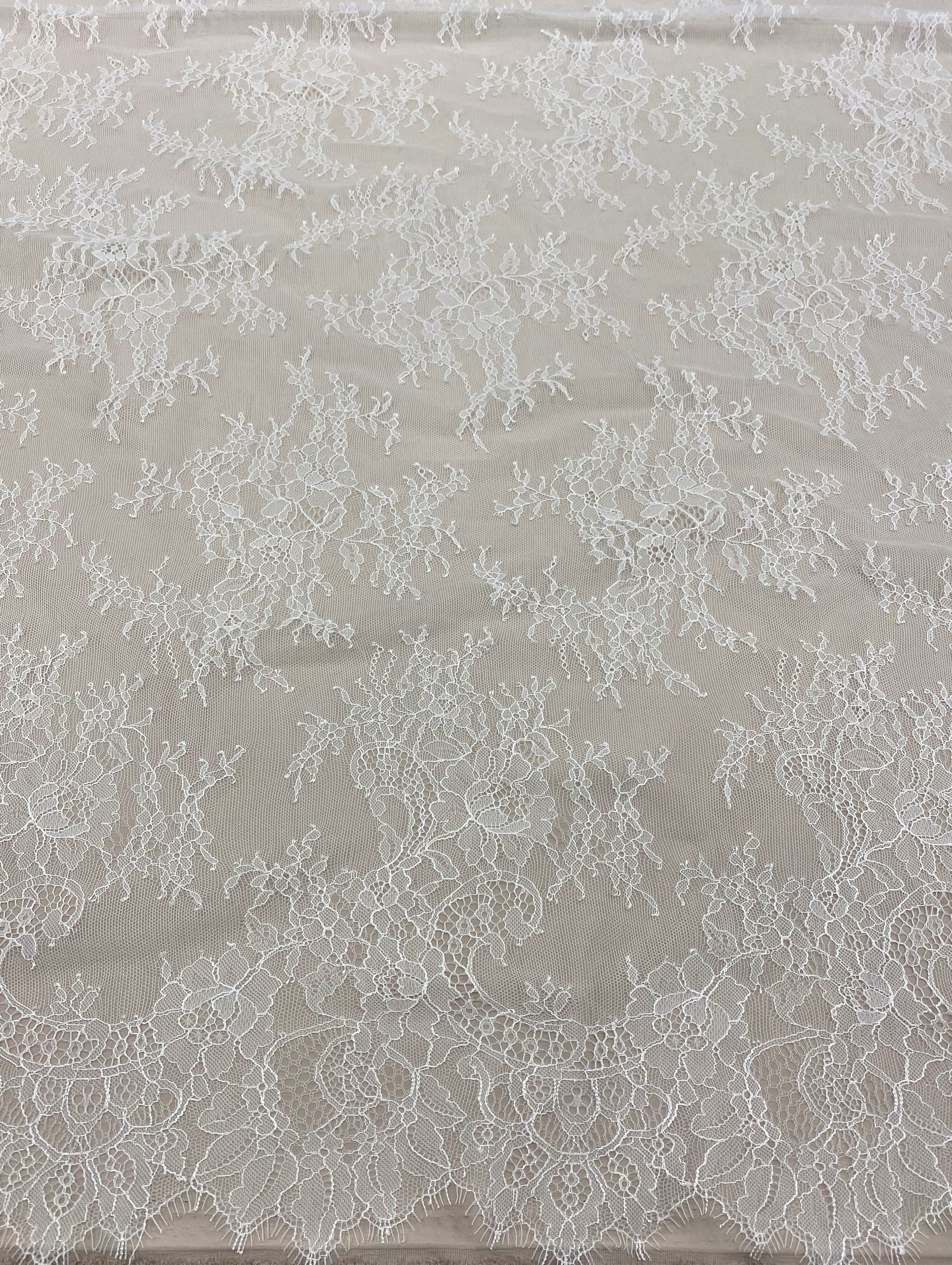 Ivory Fine Floral Lace — featuring scalloped edges, eyelash detail and floral motifs, 130cm wide