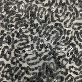 Black Sequin Georgette — heavily sequined on a 100% silk georgette base, with sequins running the length, 110cm wide