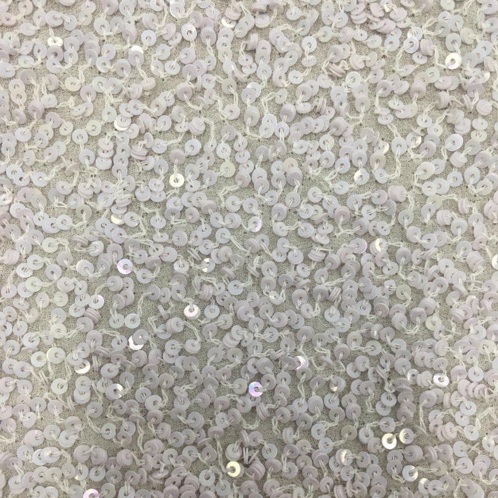White Sequin Georgette — heavily sequined on a 100% silk georgette base, with sequins running the length, 110cm wide