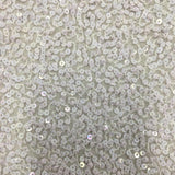 White Sequin Georgette — heavily sequined on a 100% silk georgette base, with sequins running the length, 110cm wide