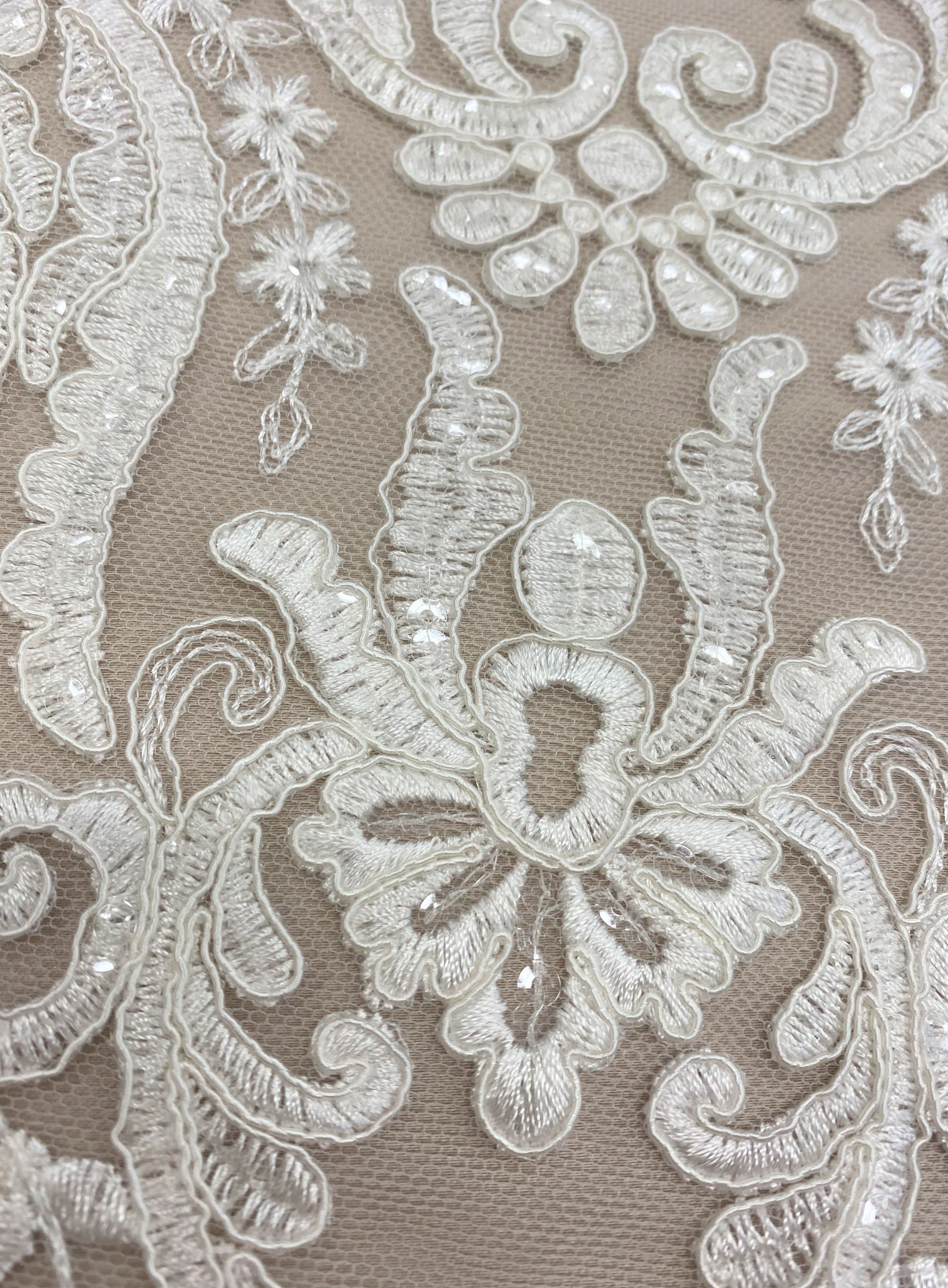 Ivory Embroidered Border Tulle — featuring a border design, 30% nylon 30% rayon 40% polyester, 130cm wide