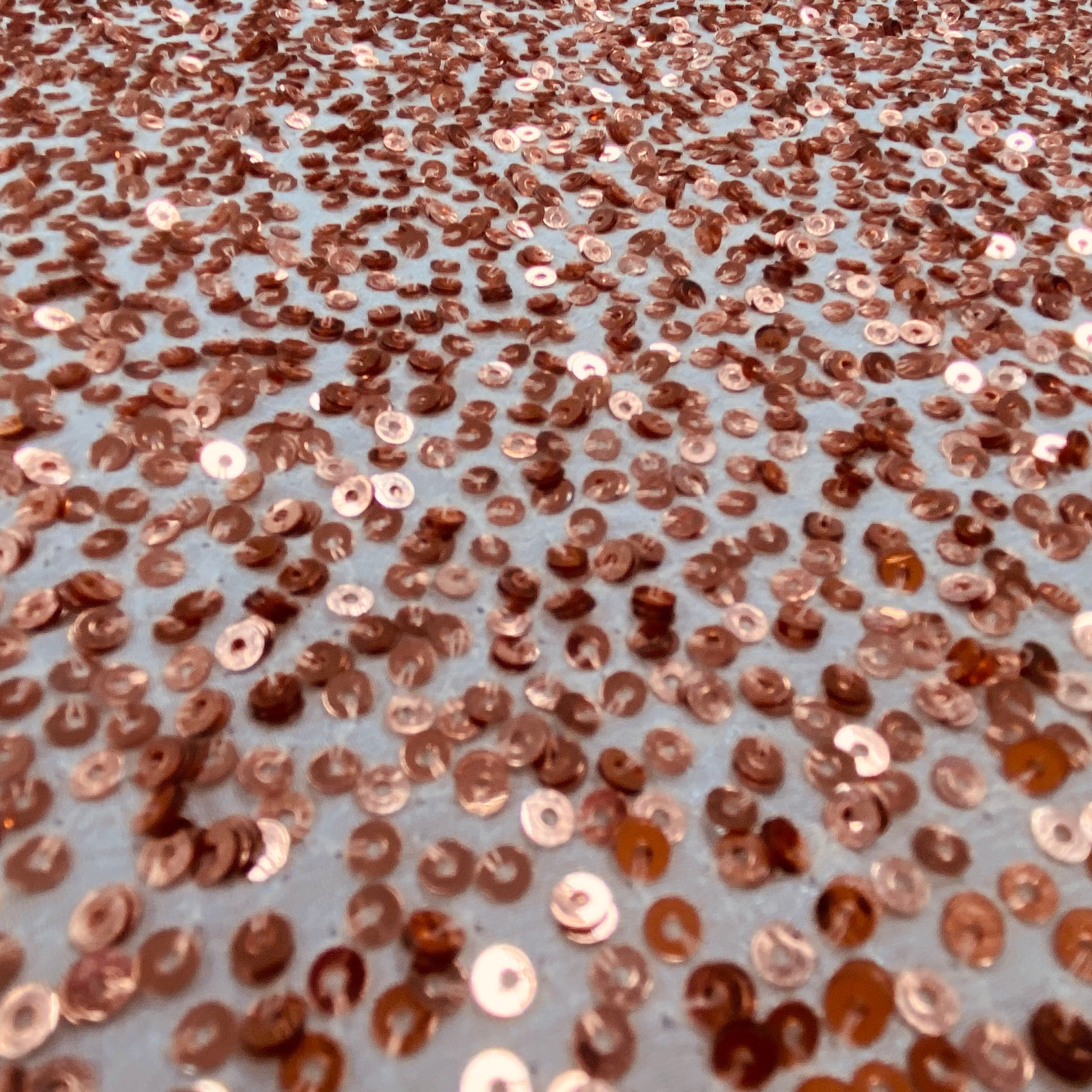 Rose Gold Sequin Georgette — heavily sequined on a 100% silk georgette base, with sequins running the length, 110cm wide