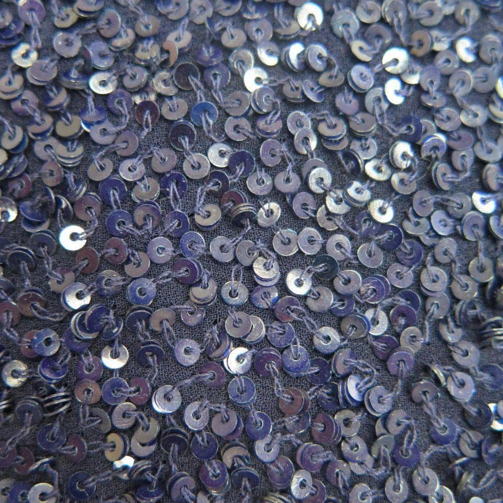 Navy Sequin Georgette — heavily sequined on a 100% silk georgette base, with sequins running the length, 110cm wide