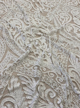 Ivory Embroidered Tulle — featuring scalloped edges and hand-beading, 50% nylon 50% rayon, 135cm wide