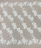 Ivory Embroidered 3D Tulle — featuring floral motifs, a 3D floral design and hand-beading, 50% nylon 50% rayon, 140cm wide