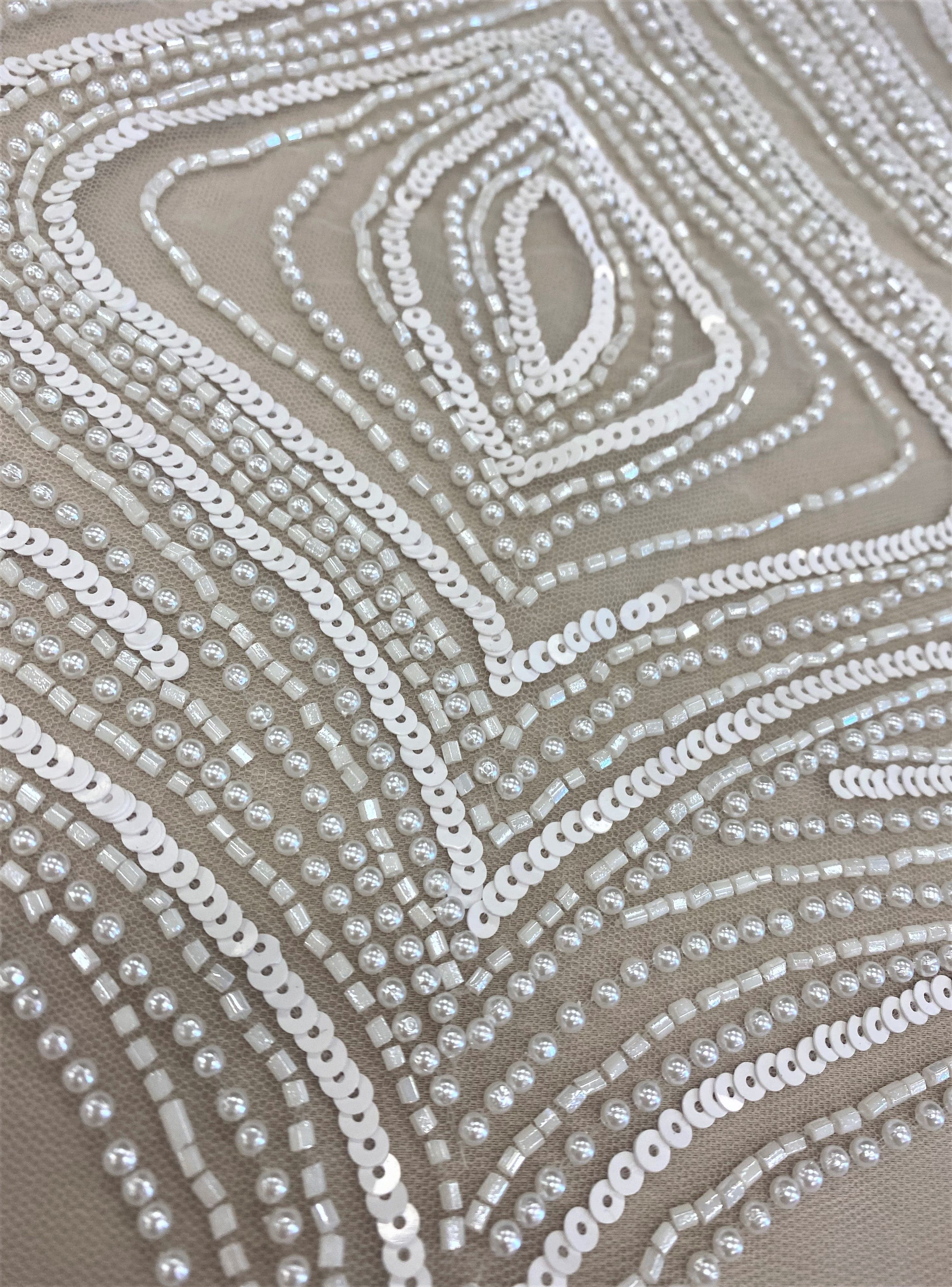 Ivory Embellished Tulle — featuring scalloped edges, hand-beading and sequins, 100% nylon, 140cm wide