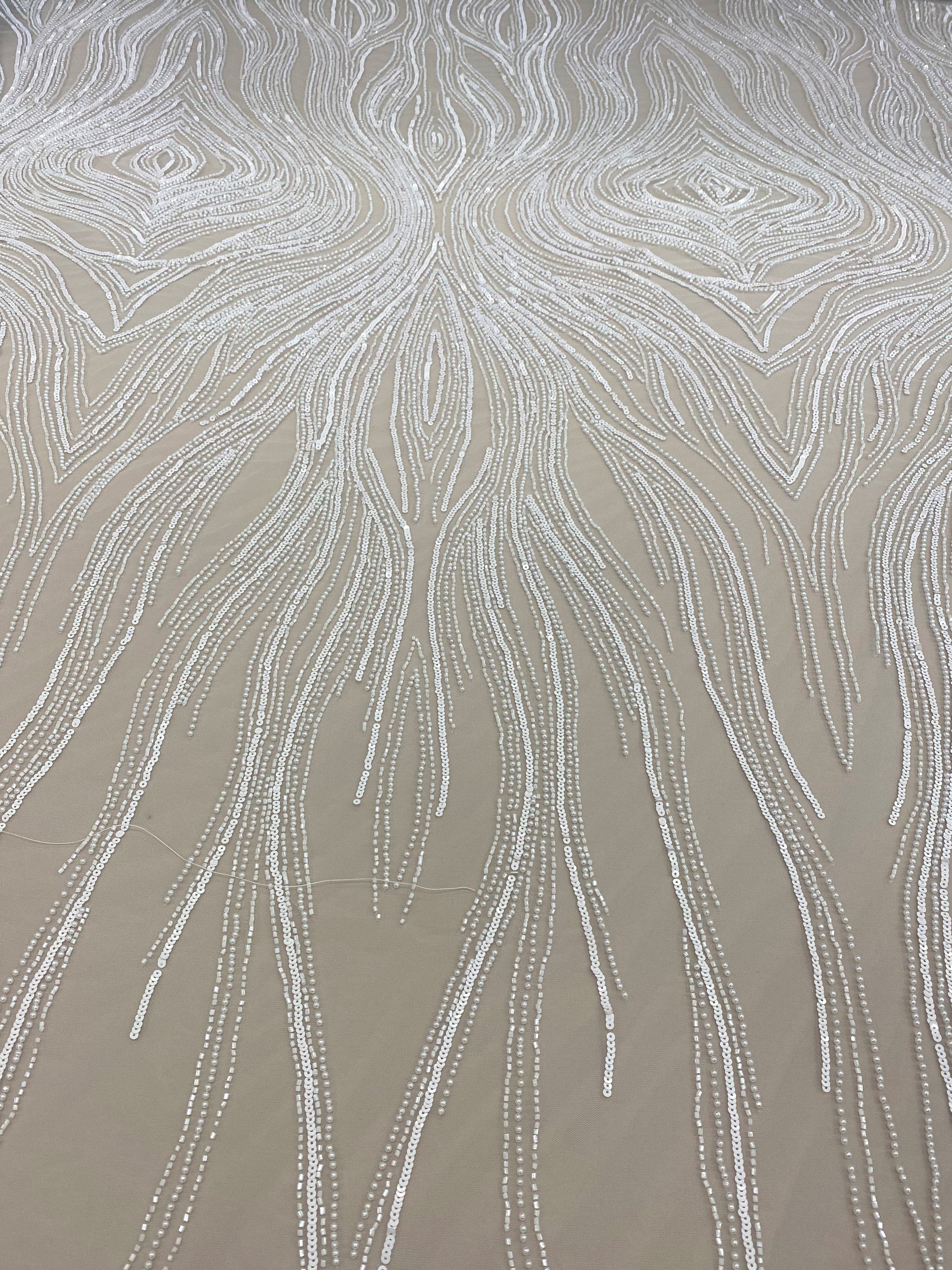 Ivory Embellished Tulle — featuring scalloped edges, hand-beading and sequins, 100% nylon, 140cm wide