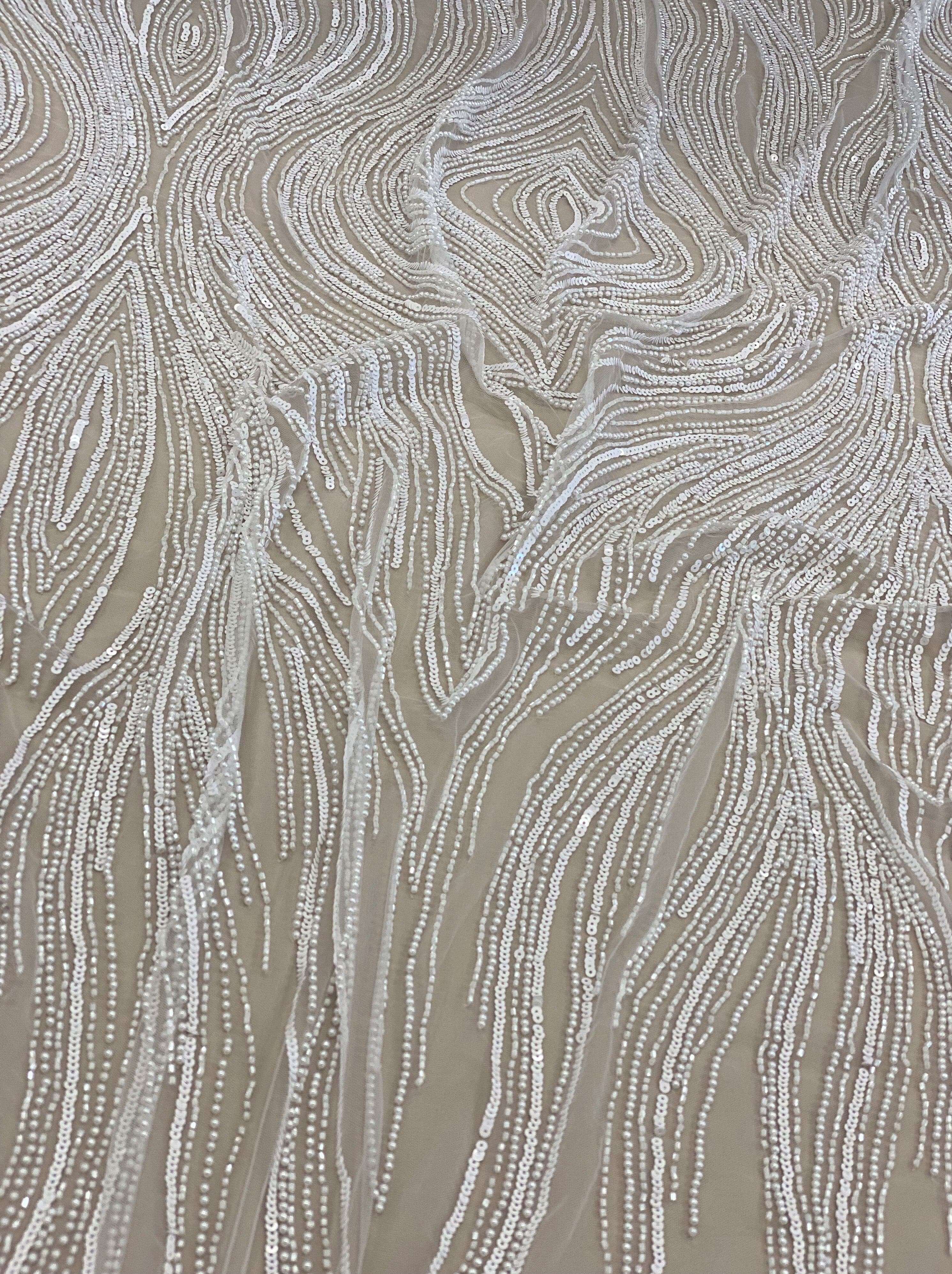 Ivory Embellished Tulle — featuring scalloped edges, hand-beading and sequins, 100% nylon, 140cm wide