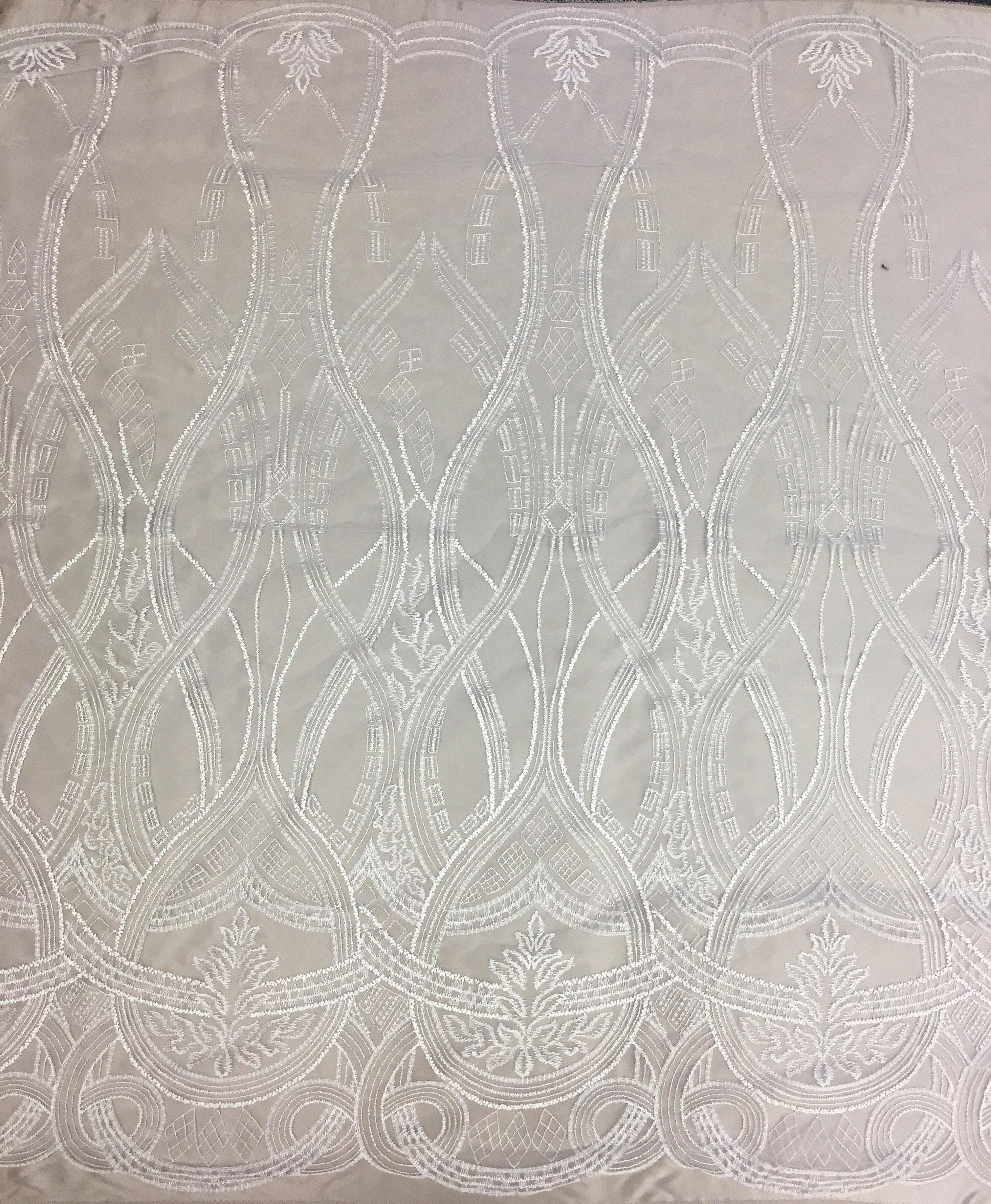 Ivory Embroidered Tulle — featuring scalloped edges, 50% nylon 50% rayon, 130cm wide