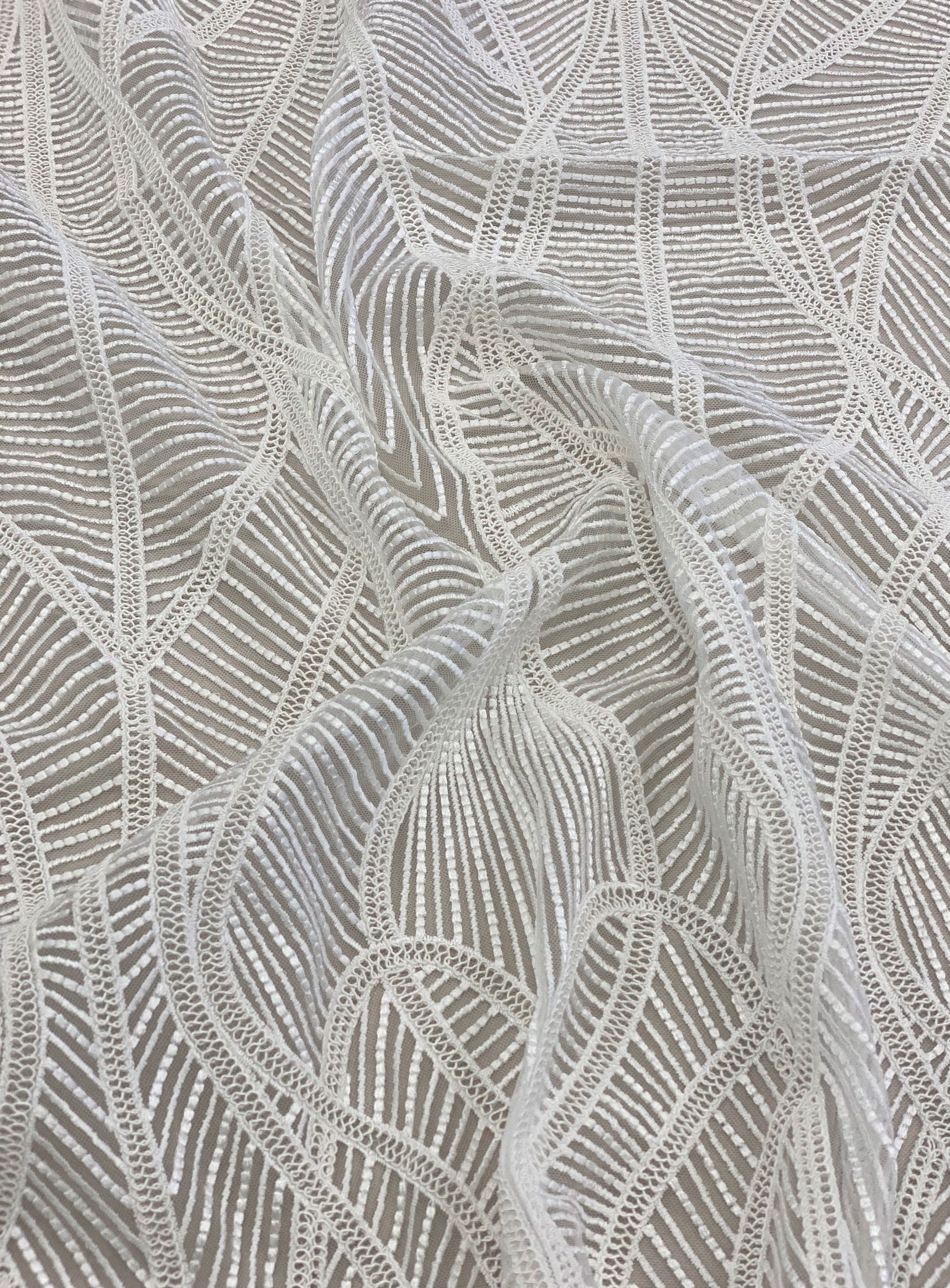 Ivory Embroidered Tulle — featuring scalloped edges and a corded texture, 50% nylon 50% rayon, 130cm wide