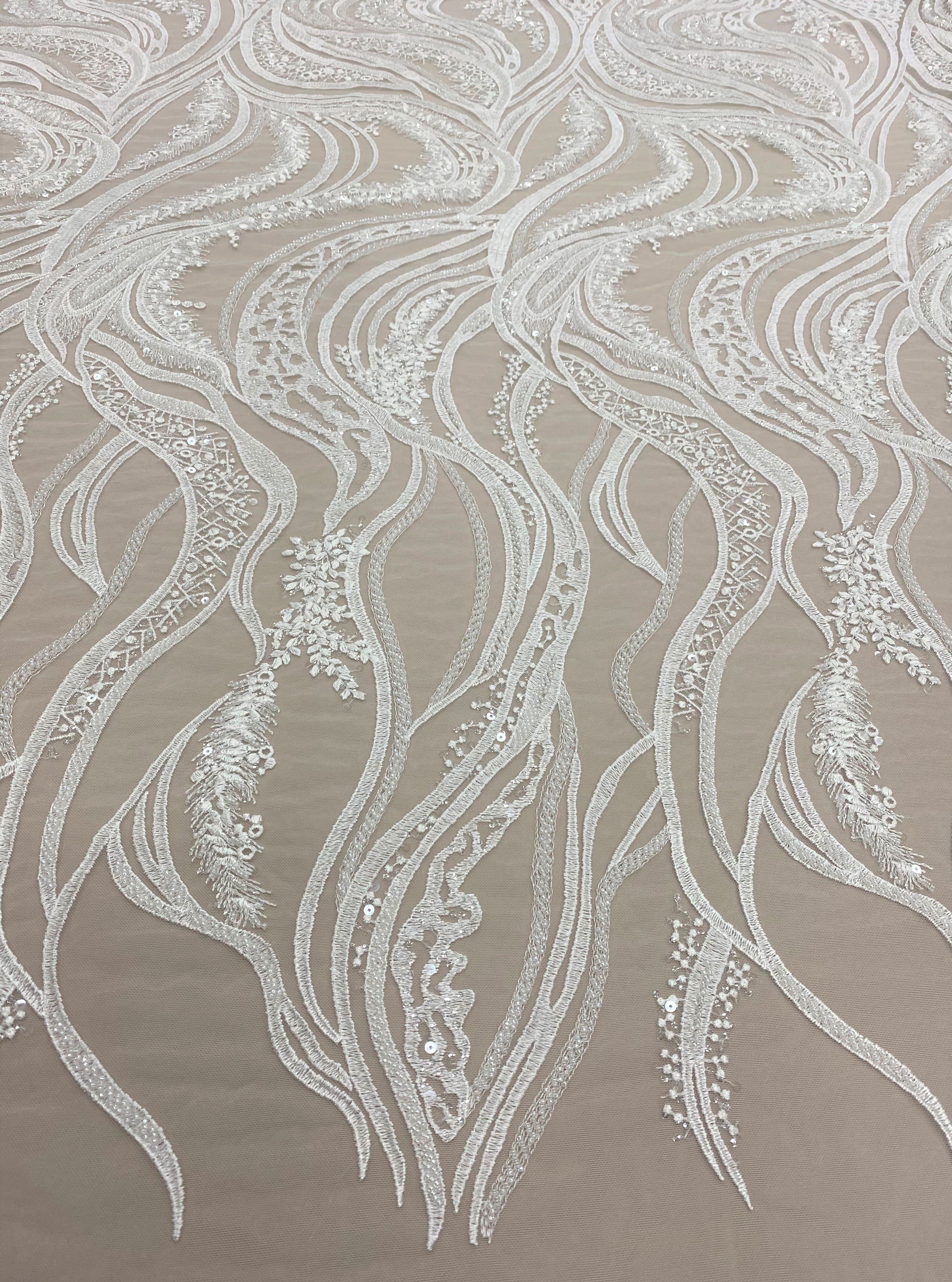 Ivory Embroidered Tulle — featuring scalloped edges, hand-beading and sequins, 50% nylon 50% rayon, 130cm wide