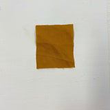 Turmeric Linen — mid-weight plain-weave linen with a slightly crisp handle that softens with wear, 100% linen, 135cm wide