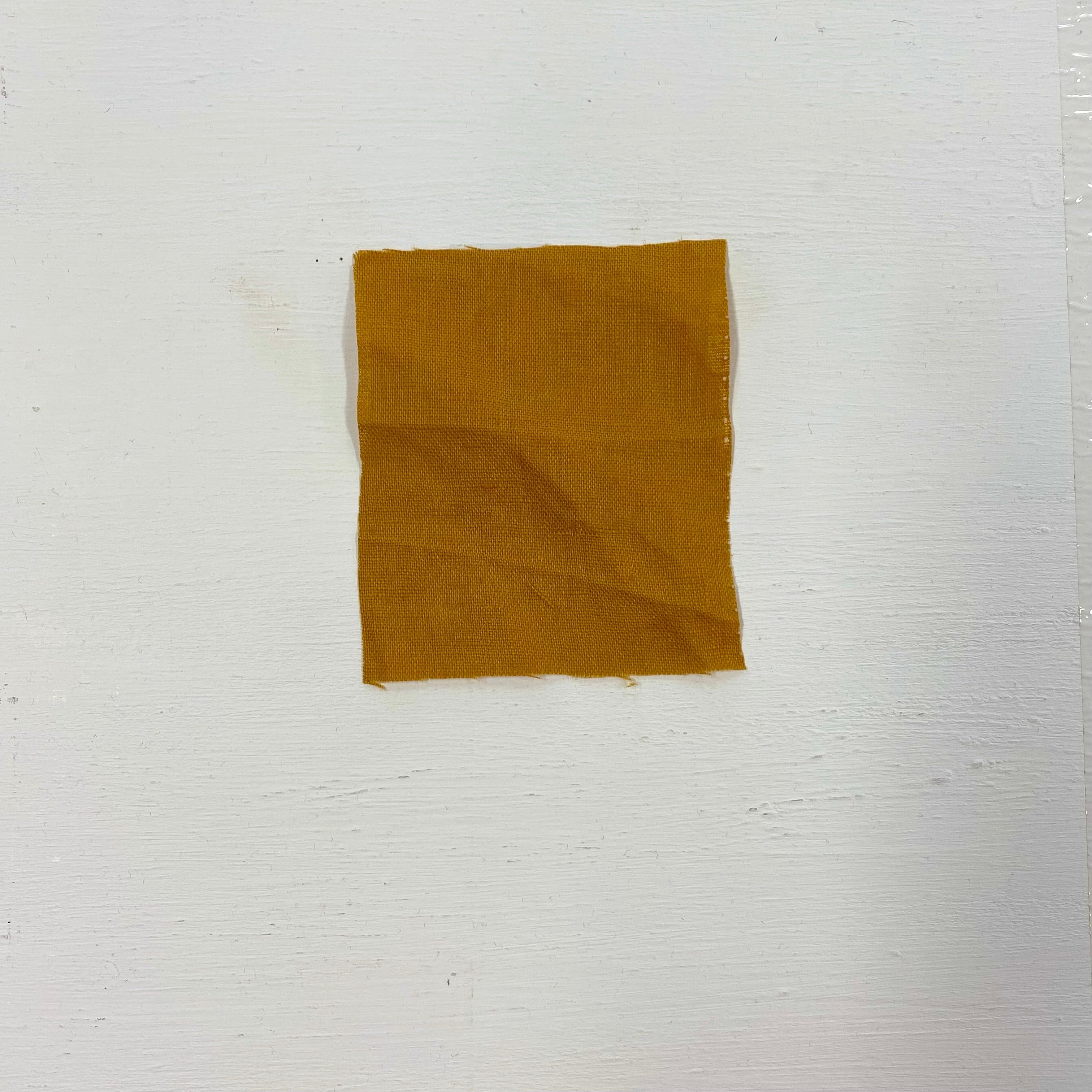 Turmeric Linen — mid-weight plain-weave linen with a slightly crisp handle that softens with wear, 100% linen, 135cm wide