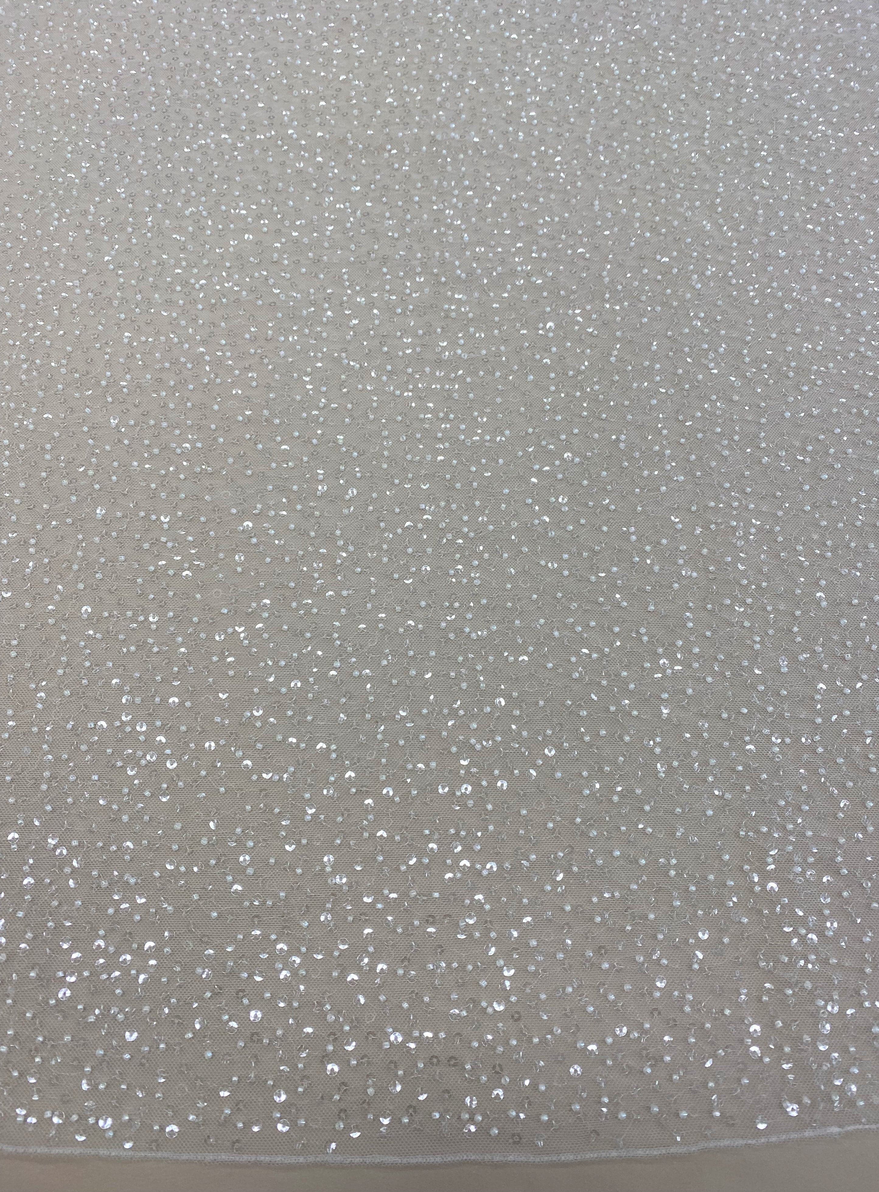 Ivory Sequin Tulle — featuring hand-beading and sequins, 100% nylon, 110cm wide