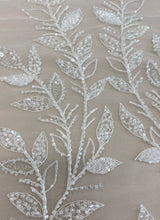 Ivory Embroidered Tulle — soft, 60% rayon 40% nylon, 140cm wide
