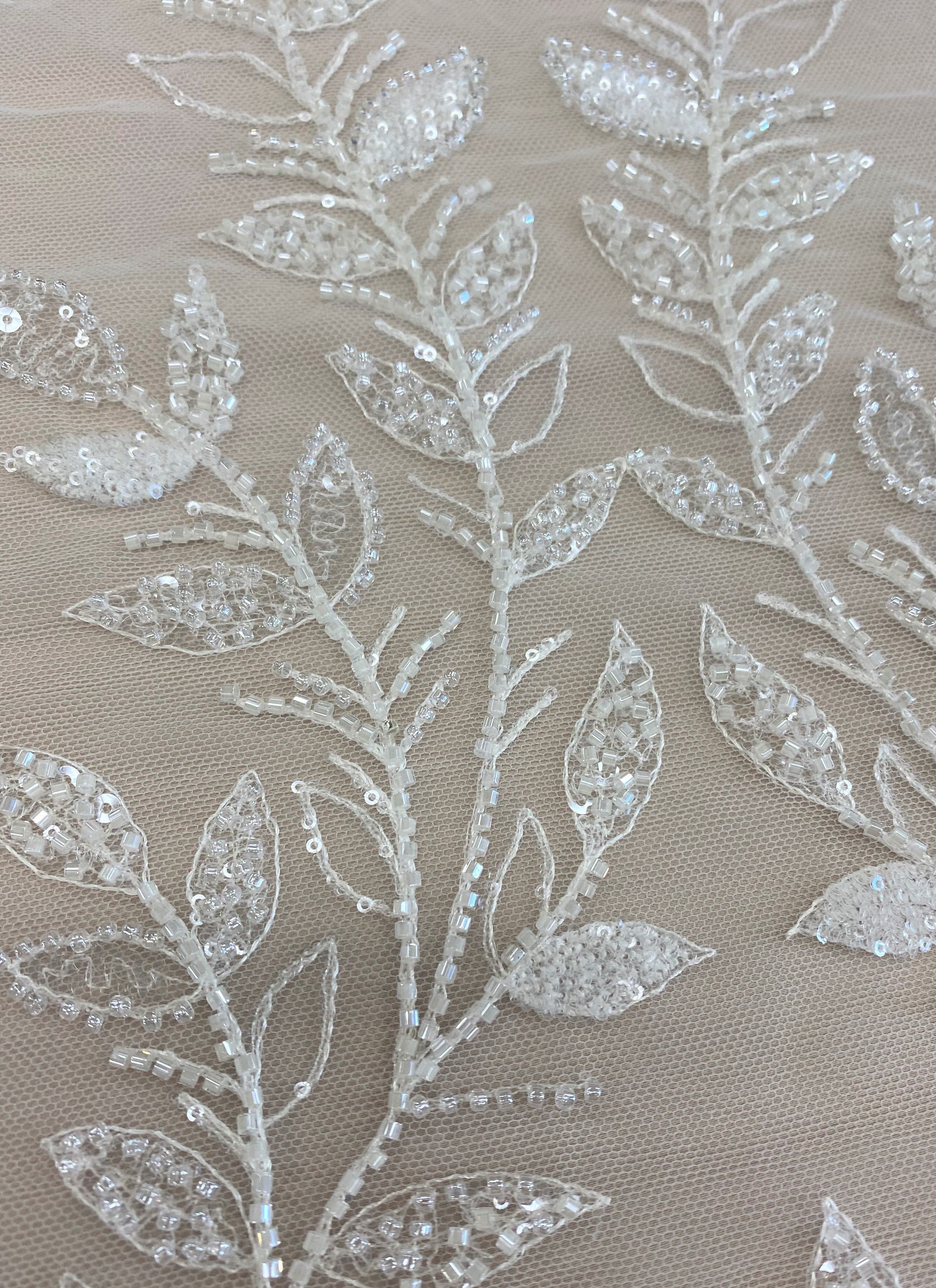 Ivory Embroidered Tulle — soft, 60% rayon 40% nylon, 140cm wide