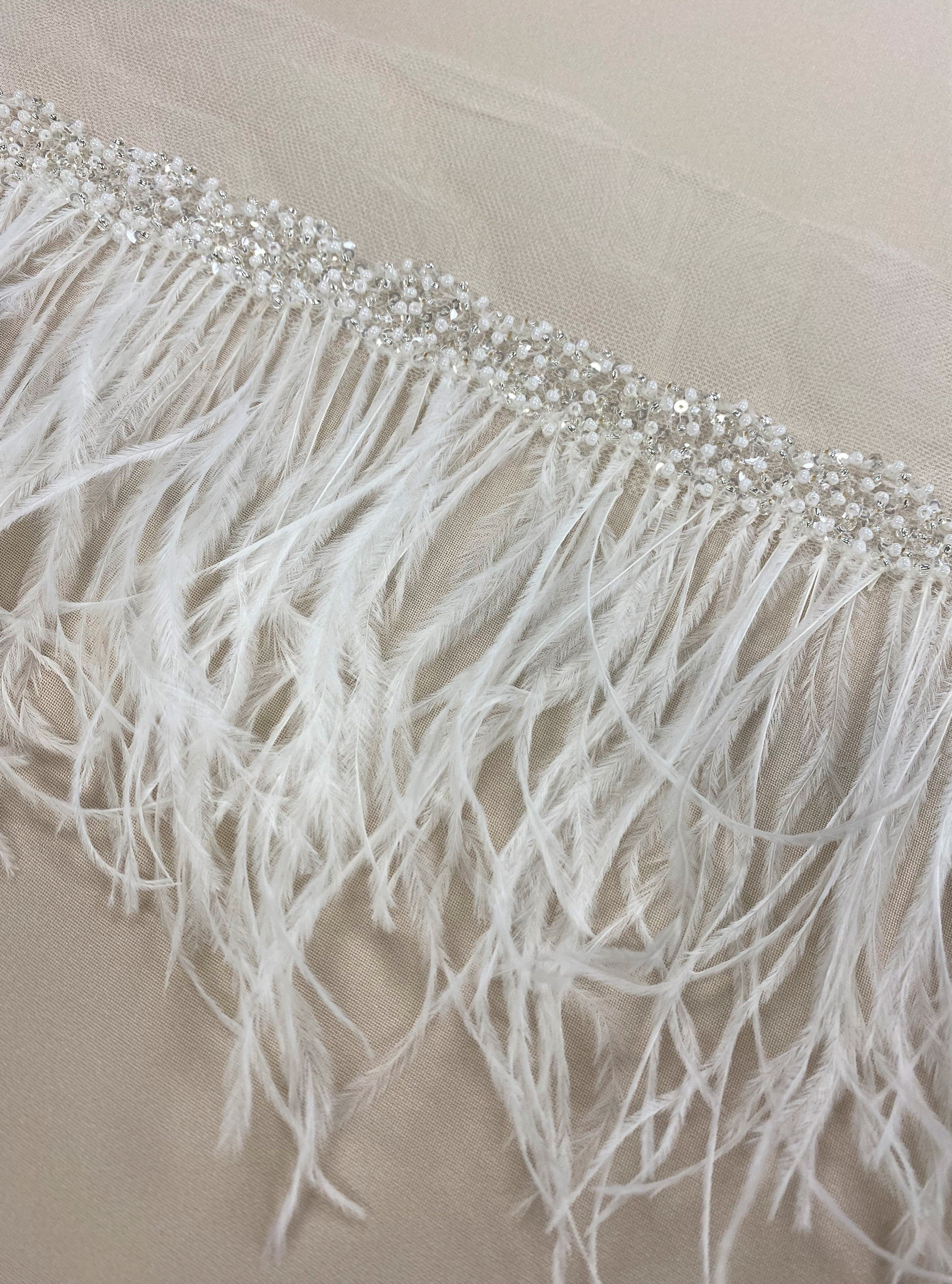 Ostrich feather trim — featuring a soft feather edge with delicate beading, mounted on tulle