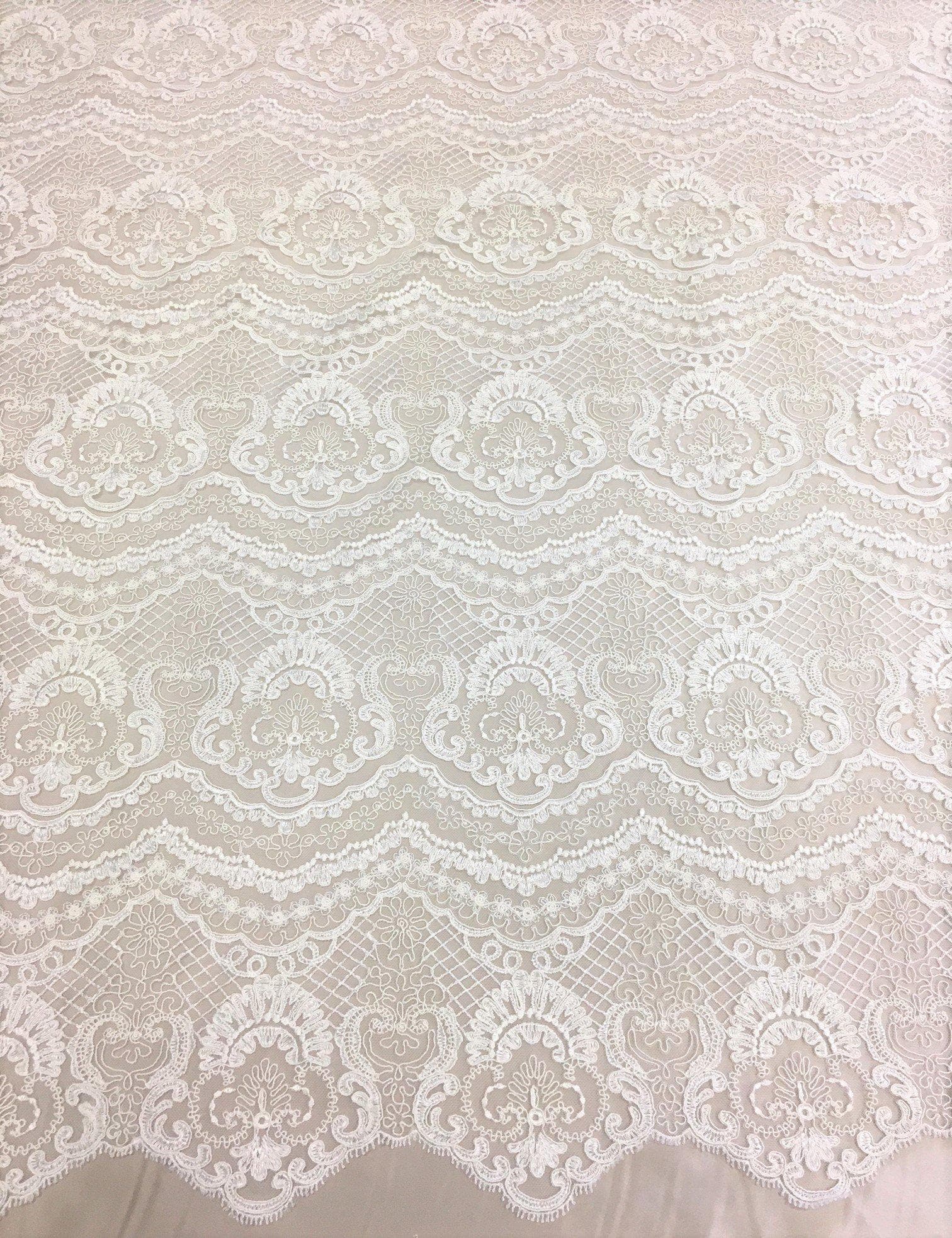 Ivory Scalloped Embroidery — featuring scalloped edges and a corded texture, 50% nylon 50% rayon, 130cm wide