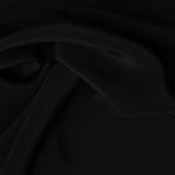 Black Crepe De Chine 23mm — a mid-weight silk crepe de chine with a matte finish and fluid drape, 100% silk, 137cm wide