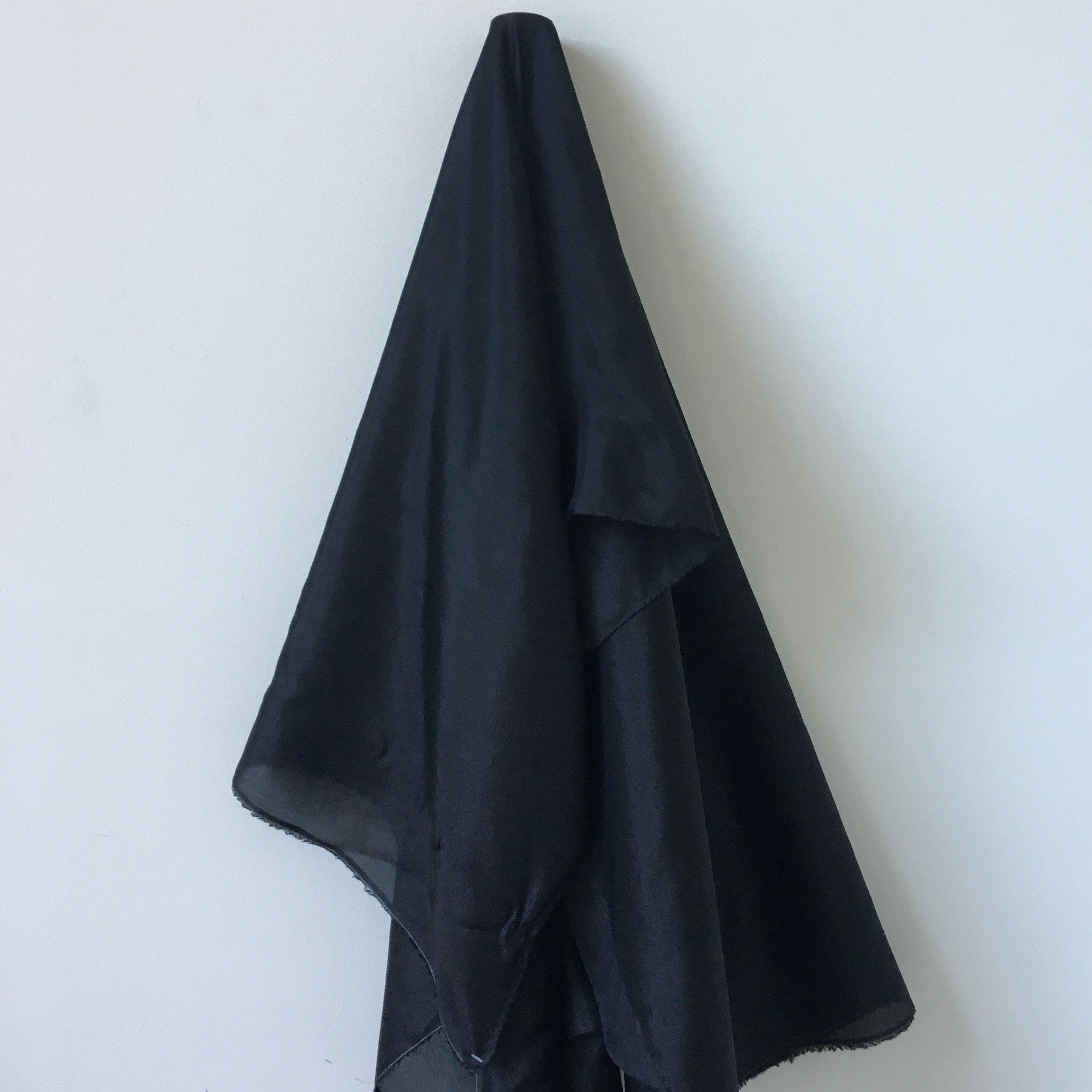 Black Habotai — soft with a light, airy drape and a smooth satin finish, 100% mulberry silk, 140cm wide